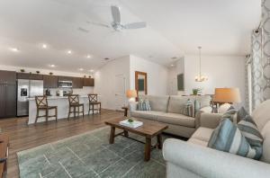 a living room with a couch and a table at Designers 3BR in The Villages With Four Seaters Golfcart King Bed in The Villages