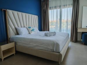a bedroom with a large bed with a large window at Villa Swenet in Aswan +28 photos