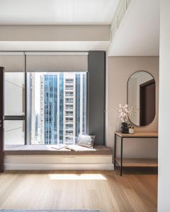 a bedroom with a window with a view of a city at The Burj View Suite Luxury 1BR Full Burj Views in Dubai
