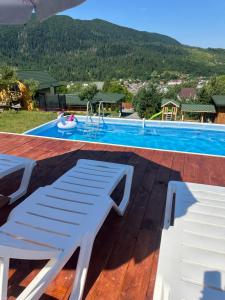 a view of a swimming pool from a house at Power Place in Mizhhirya