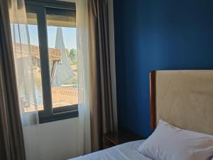 Ένα ή περισσότερα κρεβάτια σε δωμάτιο στο Villa Swenet