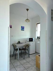 Kuchyň nebo kuchyňský kout v ubytování Apartmani Hotko 1