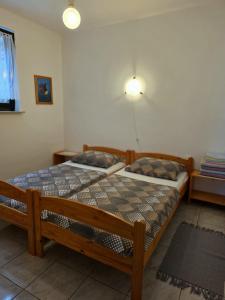 Postel nebo postele na pokoji v ubytování Apartmani Hotko 1 + 21 fotografií