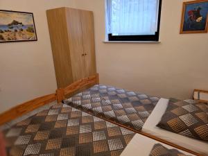Postel nebo postele na pokoji v ubytování Apartmani Hotko 1