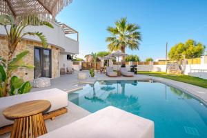 an image of a villa with a swimming pool at Anar Luxury Villas in Kalamaki