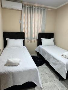 En eller flere senge i et værelse på Casa da Dona Rosa