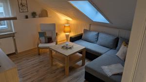 a living room with a couch and a table at Haus Meiler in Windischeschenbach