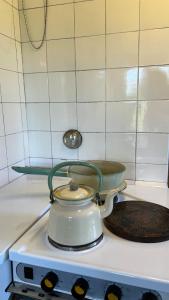 a tea pot sitting on top of a stove at Solbacka in Mysinge