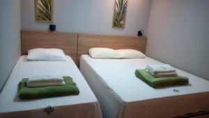 two beds sitting next to each other in a room at Zuppolini Hotel in Bananeiras +17 photos
