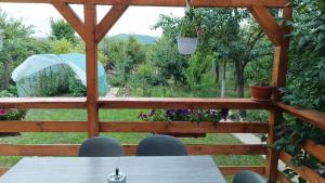 a view of a garden from the deck of a house at Casa EDI in Ferihaza