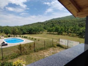 an overhead view of a swimming pool in a field at Apartman Orhideja in Sveti Rok