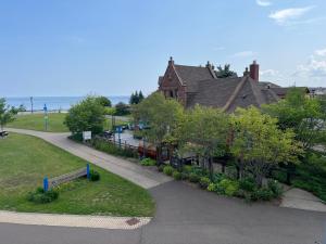 a house with a walkway next to a building at Endion Station Inn by Heirloom Boutique Collection in Duluth
