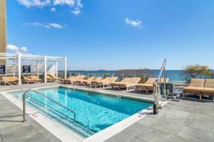 a swimming pool on the roof of a building at The Boston Beach House in Revere