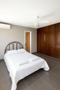 En eller flere senge i et værelse på Cobertura - Praia do Morro