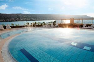 a large swimming pool on top of a building at Family Hotel Pagus - All Inclusive in Pag