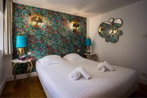 Ένα ή περισσότερα κρεβάτια σε δωμάτιο στο Villa Bellevue Vue Panoramique Flipper Billard