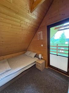 Posteľ alebo postele v izbe v ubytovaní Domki Gaja