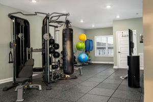 a fitness room with a gym with tread machines at Arte Luxury Townhomes O5 I Comfy 2 Bed 25 Bath in Oak Grove