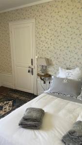 a bedroom with a bed with a blanket on it at L'Écrin du Marquis  +44 photos