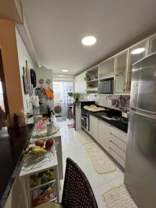 Kuchyň nebo kuchyňský kout v ubytování Apartamento em castanhal