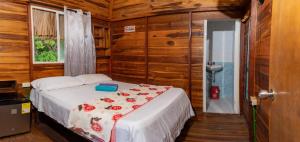 Postel nebo postele na pokoji v ubytování Cabañas Orlando y Más Na' Tayrona