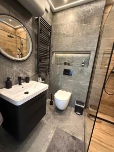 Koupelna v ubytování Cor Montis Apartments + 23 fotografií