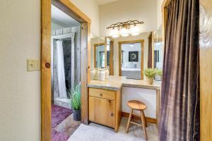 a bathroom with a sink and a mirror at Swim, Hike and Unwind Serene Hill Country Retreat in Kerrville +29 photos