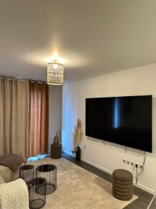 Μια τηλεόραση ή/και κέντρο ψυχαγωγίας στο Appartement luxueux avec jacuzzi