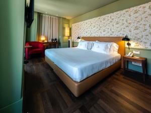 Postel nebo postele na pokoji v ubytování Lisboa Carmo Hotel + 69 fotografií