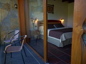 Ein Bett oder Betten in einem Zimmer der Unterkunft Hotel Pucon Green Park