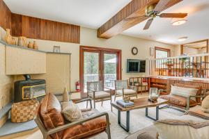 a living room filled with furniture and a fireplace at Shohola Creek On-Site Updated Getaway with Deck! in Shohola