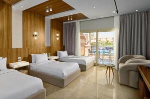 Voodi või voodid majutusasutuse Ramage Hotel & Resort toas