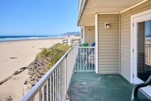 a house with a walkway to the beach at Ground Floor Condo - Ocean View - Pool & Hot Tub in Lincoln City +19 photos