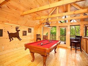 a room with a pool table in a cabin at Diamond Mine Holiday home in Gatlinburg