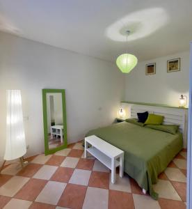 Ένα ή περισσότερα κρεβάτια σε δωμάτιο στο Residenza Il Cavallo e La Torre