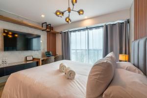 Ένα ή περισσότερα κρεβάτια σε δωμάτιο στο Orum Loft by Geko