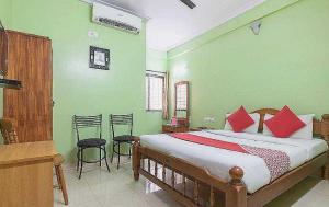 Postel nebo postele na pokoji v ubytování Hotel O Sree Nandanam Residency