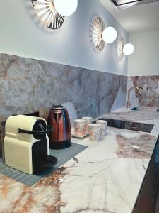 Kuchyň nebo kuchyňský kout v ubytování Lemon Suites Santander
