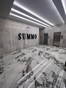 a room with a sign on a wall with a marble floor at Summo bilding in Jeddah