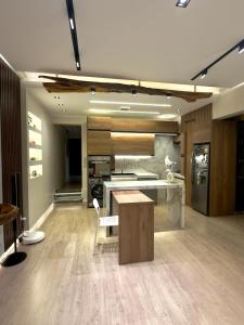 a large kitchen with a table and a counter top at Lovely One-bedroom Villa in Sharm El Sheikh