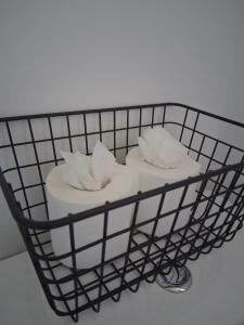 a wire basket with towels on top of it at Crown House Studio Apartment in Birmingham +21 photos