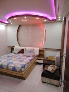 Ένα ή περισσότερα κρεβάτια σε δωμάτιο στο mraco apartment