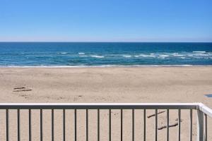 a view of a beach with the ocean at Stunning Oceanfront Suite - Full Kitchen - Pool and Hot Tub in Lincoln City +20 photos