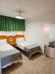 A bed or beds in a room at Seaview Friendly Holiday Home 2