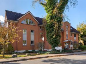 a large brick building with a stop sign in front of it at Friederike in Tarnewitz