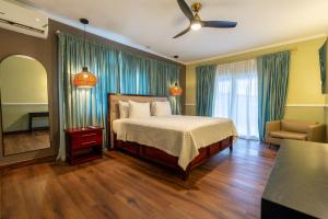 A bed or beds in a room at Travellers Beach Resort