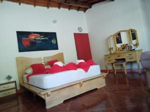 Postel nebo postele na pokoji v ubytování Libélula finca-hotel