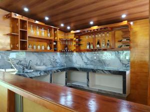 a bar with a marble counter in a room at Hostal Pakore Wera in Bahía Solano