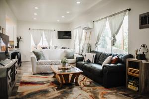 a living room with a couch and a table at The Berkeley House in Klamath Falls