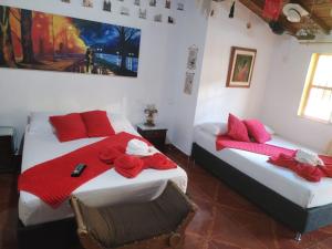 Postel nebo postele na pokoji v ubytování Libélula finca-hotel